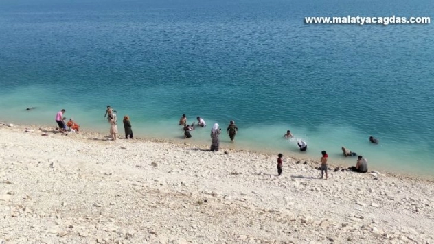 Artan boğulma vakalarına rağmen barajda serinlediler