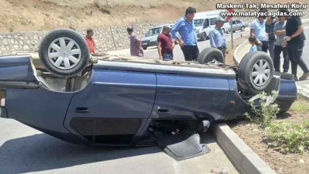 Ters dönen otomobilden burnu kanamadan çıktı
