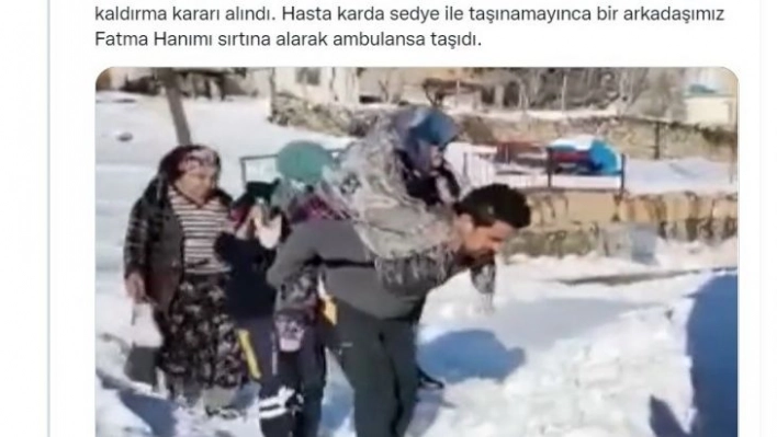 Sağlık görevlisinin sırtında taşıdığı kadından teşekkür